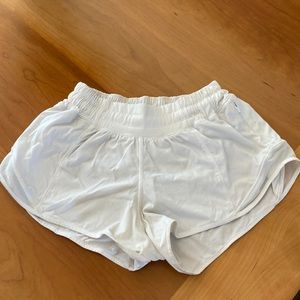 In pretty good condition, white size 2 lululemon shorts!